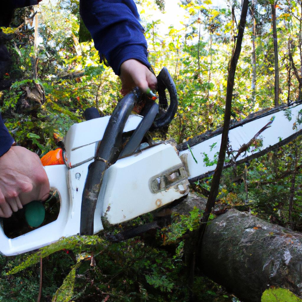 Person operating chainsaw in forest