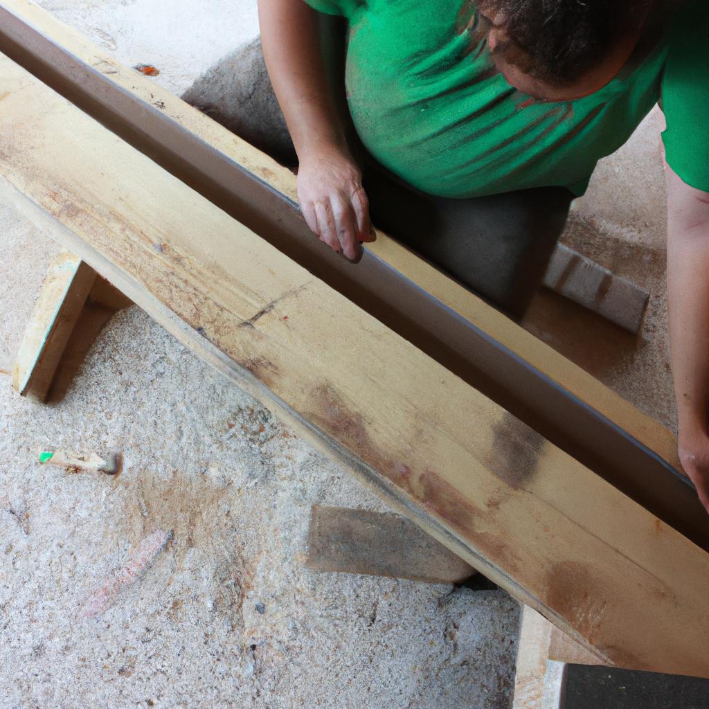 Person working with wooden beams